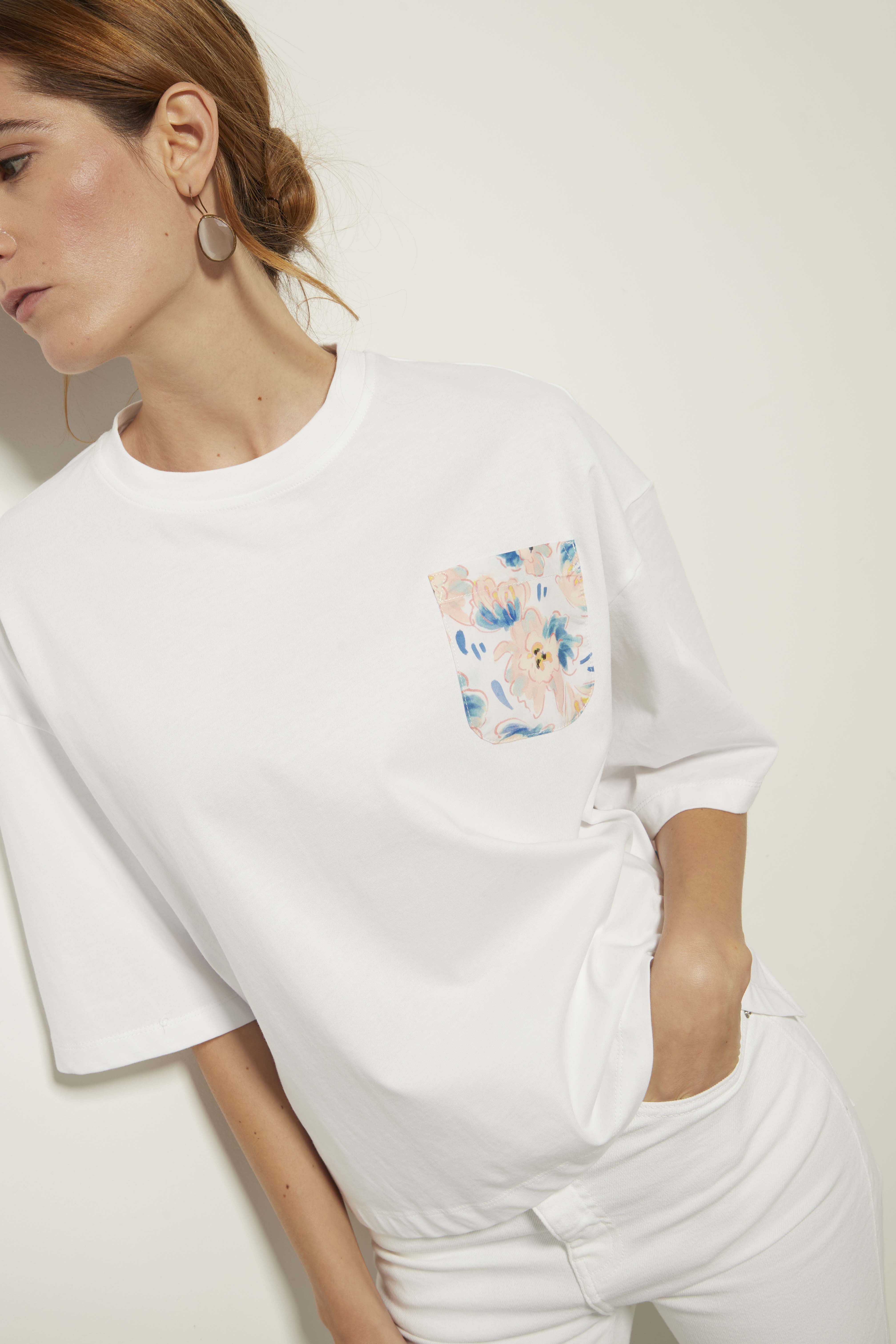 White T-shirt with floral texture and graphic details